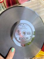 Close-up of an Edison brand antique vinyl record titled 'The Preacher and the Bear'