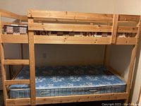 Assembled bunk bed frame with mattress (mattress not included)