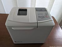 White Regal Kitchen Pro breadmaker showing top with handle and viewing window