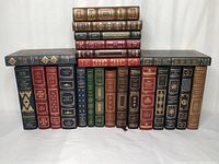 Front view of leather-bound volumes arranged in two rows