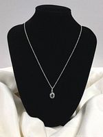 Full view of necklace displayed on black bust stand, showing chain and pendant size and style.