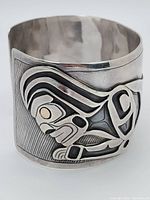 Front view showing raised indigenous formline design