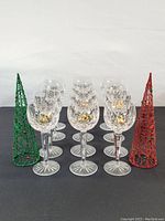 All nine hock wine glasses arranged in three rows with decorative cones