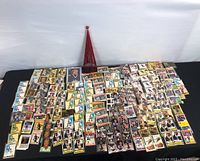 Top-down view of entire lot of hockey cards spread on a black tablecloth