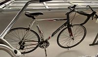Full side view of Trek 1200 SL bike showing frame, wheels, sport handlebars, and pedals.