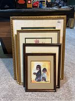 Seven framed prints stacked showing different frame styles and sizes, varying from 16x12 to 29x24 inches, including floral and Native American motifs.