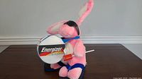 Front side view of pink plush Energizer Bunny with drum and sunglasses