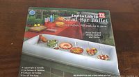 Box front showing inflatable salad bar in use with food and drinks, highlighting its portability and cooling function.
