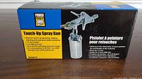 Box of new Power Fist Touch-Up Spray Gun, showing front with product description and specifications.