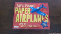 Box featuring the title 'High-Performance Paper Airplanes' and an image of a blue paper airplane.