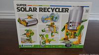Front of box showing Super Solar Recycler kit with images of possible finished models demonstrating solar power applications.