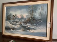 Full view of framed acrylic painting showing winter cabin scene