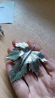 Silver leaf brooch front view showing size and texture
