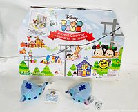 Photo showing the Disney Tsum Tsum 2017 Holiday Advent Calendar box with Christmas-themed graphics and indicator of 25 pieces and 24 surprises inside.