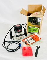 Full view of Sears Craftsman heavy duty power router with power cord, box, manual, wrench, and red bit case