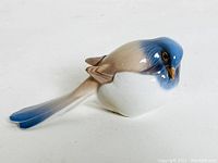 Top side view of the blue, beige and white porcelain Titmouse bird figurine.