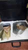 Two male head portrait studies on paper, one wearing a cap and one in profile with white shirt