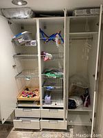 Photo of inside left and middle compartments showing wire baskets, shelves with items, and wooden drawers at the bottom