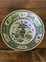 Top down view of the bowl showing full hand painted detailed interior floral and traditional motifs design.