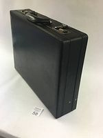 Black Bugatti attache briefcase upright showing overall condition and shape.