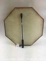 Top view of octagonal frame drum showing rawhide stretched surface and wooden frame