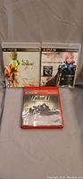 Three PS3 game cases visible: Final Fantasy XIII-2, Final Fantasy XIII, Fallout 3 Greatest Hits