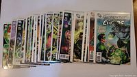 Full comic book lot showing multiple DC Comics issues with vibrant cover art.