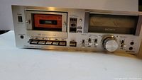 Full front view of the Sony TC-U5 cassette deck showing cassette slot, control buttons, headphone jack, and power switch.