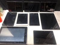 Lot of 9 tablets of various brands and conditions with damaged screens and bodies