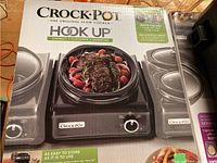 Box of Crock-Pot Hook Up original slow cooker showing image of product and food inside, highlighting capacity and features.