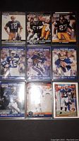 First binder page showing nine NFL Pro Set cards including 1990 Pro Bowl players and other NFL stars