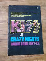 Front cover view of KISS Crazy Nights World Tour 1987-88 book showing title and band images.