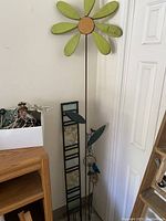 Close-up of large garden flower showing wooden petals and circular center