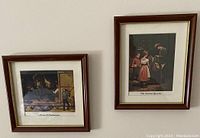 Two framed art prints on a light wall, depicting vintage paintings titled 'Music is Contagious' and 'The Scissors Grinder'.