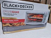 Box featuring Black+Decker Crispy Bake Large Capacity Air Fry Convection Oven, highlighting air fry technology, large capacity for 9x13 inch pans, five cooking functions, and high-intensity heat airflow.