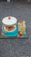 Full view of vintage Fisher Price wooden kitchen playset with stove and cooking turntable on base