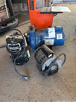 Photo showing all three items: MasterCraft electric motor, GSW pump, and older electric motor