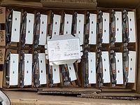 View of over 10 brand new ECODE ECO18 LED drivers in original packaging with one unit face up showing labels and specifications.