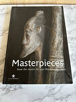 Front cover of the book showing a photograph of a carved wooden figure from the musée du quai Branly collection.