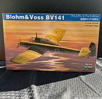 Box front of Blohm & Voss BV 141 plastic model kit showing detailed artwork of the asymmetric aircraft flying at sunset with size details and branding visible.