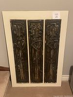 Full view of three etched tin panels mounted on white backing, showing Don Quixote figures and general condition