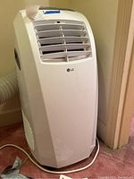 Front view of LG portable air conditioner showing vent and LG logo