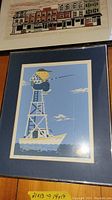Two signed and numbered prints, one with a fisherman illustration and the other with buildings.