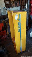 Yellow Cub Cadet metal tow behind cart with branding visible on the side panel.