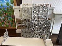 Full view of all decorative wall panels and the wall shelf stacked together showing size, color, and design details.