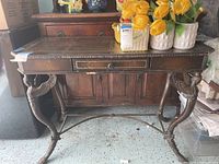 Full front view of the console table with objects on top