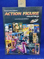 Front cover of the book with colorful images of vintage action figures and ruler for size.