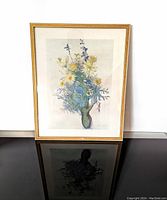 Front view of the framed floral art print featuring daisies, stock, delphinium, and larkspur.