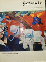 Cover page of the book showing a Gauguin painting with people in colorful attire and text reading 'Gauguin' and 'Text by Robert Goldwater'