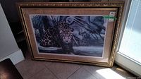 Full view of the framed limited edition print featuring a leopard in a natural setting.